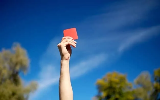 A close-up shot of a hand holding several different credit cards, fanned out, with an airplane flying in the background on a blurred map.