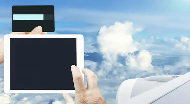 A hand holding a premium travel credit card against a backdrop of a blurred airplane window view of clouds, symbolizing financial freedom and travel rewards.