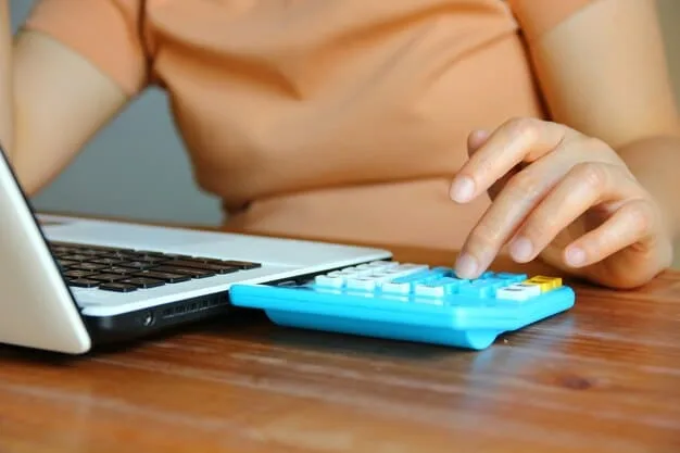 A person using a calculator with a stack of coins and a health insurance card, symbolizing smart financial decisions related to healthcare. The background is blurred, focusing on the foreground elements.