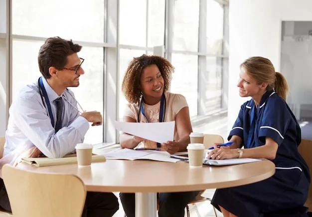 A group of diverse people discussing and looking at health insurance documents around a table, with a confident and hopeful expression.