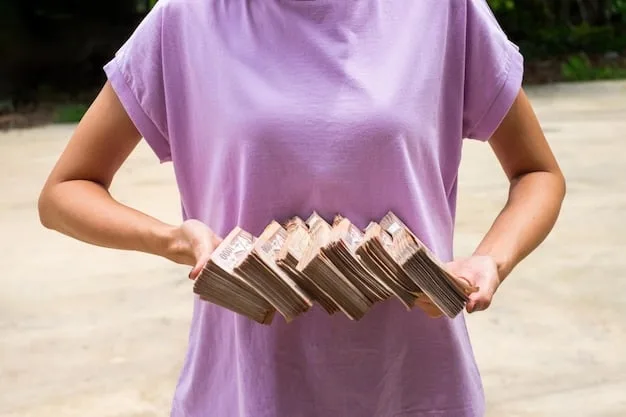 A close-up of a person's hands holding a stack of bills and looking stressed, with blurred background elements suggesting a busy, financially burdened life.
