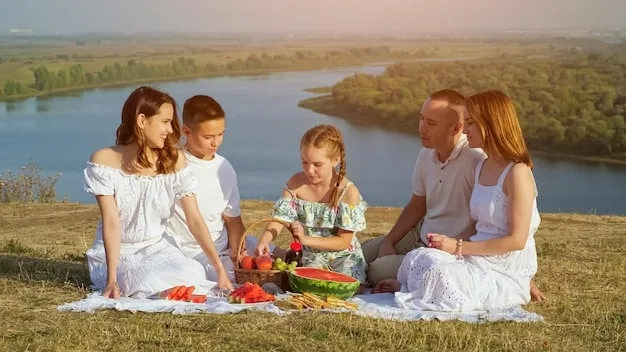 A family enjoying a picnic in a beautiful park with a city skyline in the background, demonstrating budget-friendly family activities.