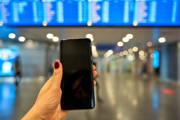 A close-up of a hand holding a smartphone displaying a flight search app, with a blurred background of airport departure boards, emphasizing technology in travel.