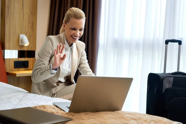 A traveler on the phone, smiling, talking to a hotel representative, with a laptop open showing hotel booking websites in the background, depicting direct negotiation success.
