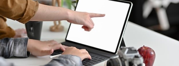 A person's hand hovering over a laptop screen, pointing at a small, almost hidden checkbox for 