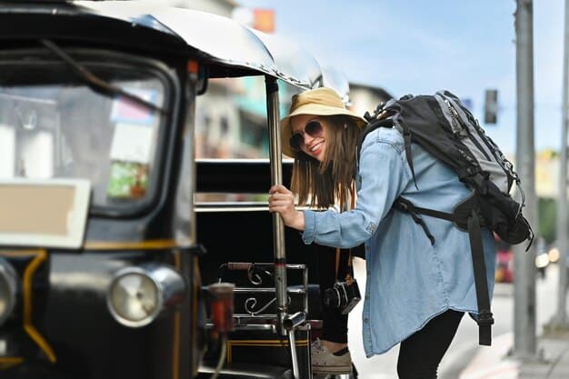 A solo backpacker with a small backpack and a wide-brimmed hat is riding a local bus through a bustling street market, surrounded by colorful stalls and local vendors.
