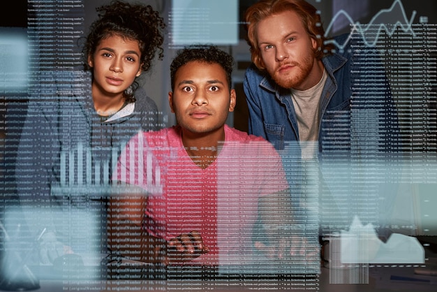A diverse group of cybersecurity professionals collaborating around a large data visualization screen, symbolizing teamwork and advanced threat analysis.