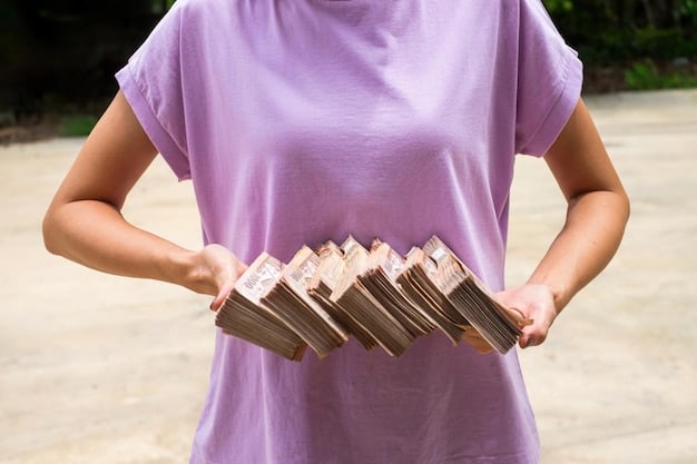 A close-up of a person's hands holding a stack of bills and looking stressed, with blurred background elements suggesting a busy, financially burdened life.