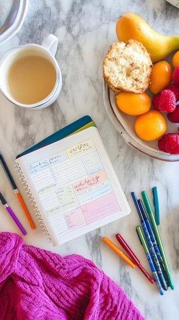 A detailed weekly planner with color-coded subjects and activities, alongside a hot cup of tea, illustrating an organized yet cozy homeschooling setup.