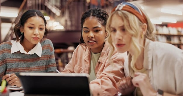 A diverse group of students animatedly collaborating on a digital project in a modern US classroom, using laptops or tablets provided by the school, showcasing equitable access.