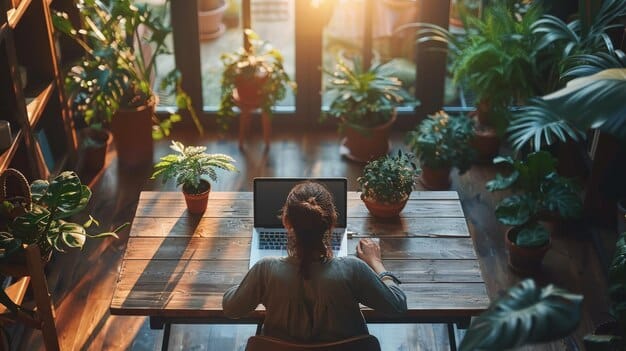 A young professional meditating briefly at their desk, surrounded by office plants and a soft light, symbolizing self-management and emotional well-being in a work setting.