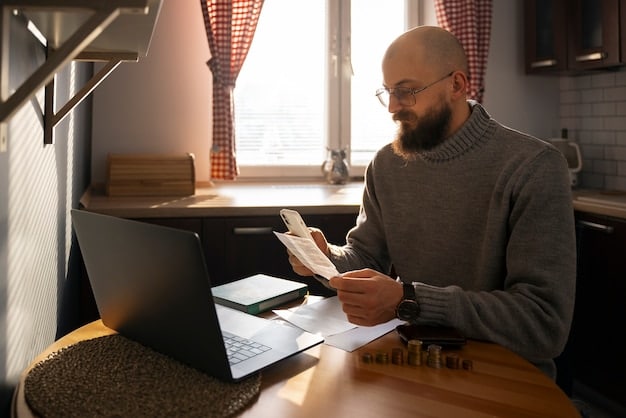 A person using a laptop with tax software open, while reviewing financial documents, illustrating proactive tax management and planning.