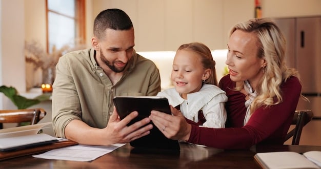 A family reviewing tax documents on a tablet, with a child in the background, symbolizing the impact of tax changes on family finances.