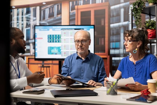 A diverse group of people in an office setting, some looking at computer screens with charts, others in a meeting, conveying a sense of collaboration and adaptability in the face of economic change.