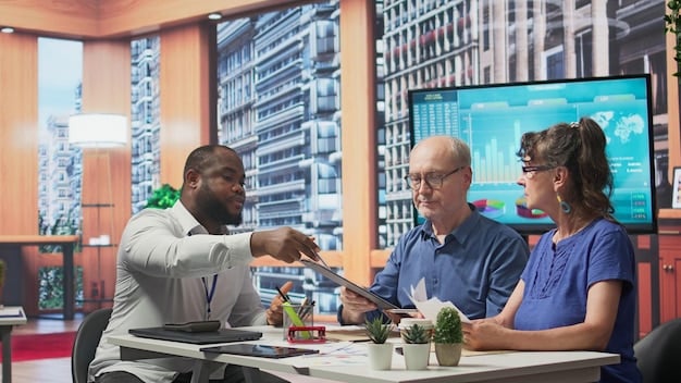 A diverse group of business professionals in a modern office collaborating on a project, with digital graphs on a screen in the background showing investment growth.