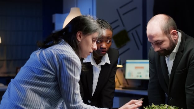 A diverse team of small business professionals collaborating around a table, analyzing financial reports and strategizing, depicting proactive adaptation to new regulations.
