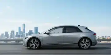 Electric vehicle driving on a road, symbolizing new EPA emissions standards