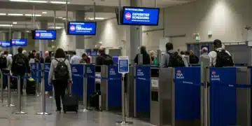 Travelers moving efficiently through a modern airport security checkpoint with expedited screening.