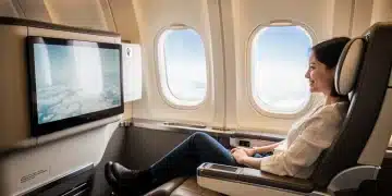 Traveler enjoying first-class upgrade on an airplane